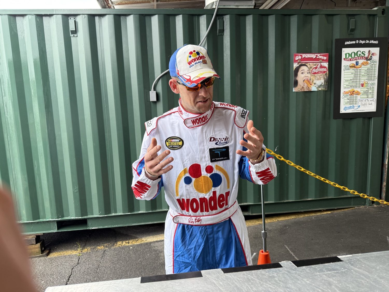 A visitor in a race car driver costume
