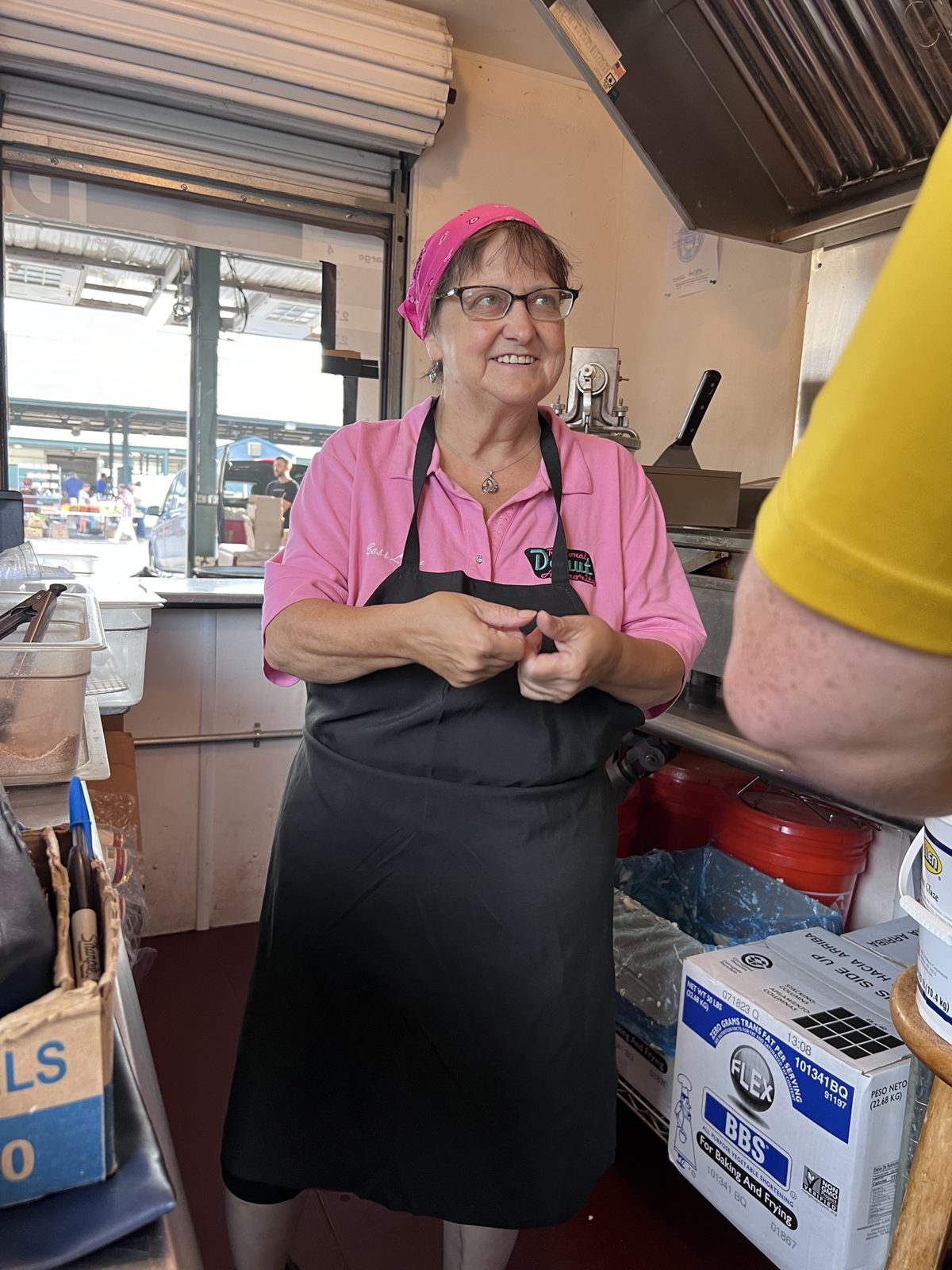 Smiling worker at the stand